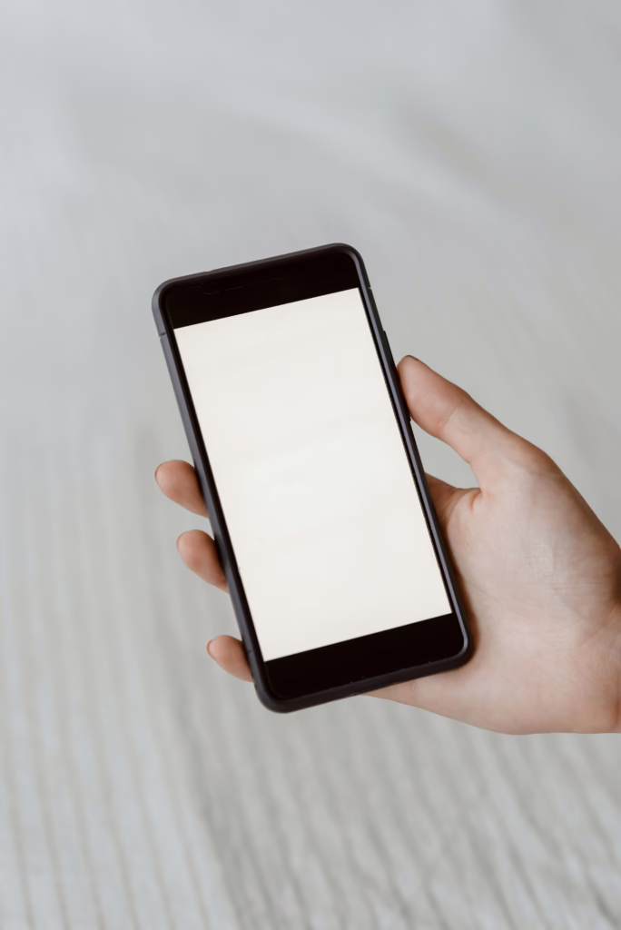 pexels-photo-4792351-4792351 A close-up of a hand holding a smartphone with a blank screen, perfect for mockups.